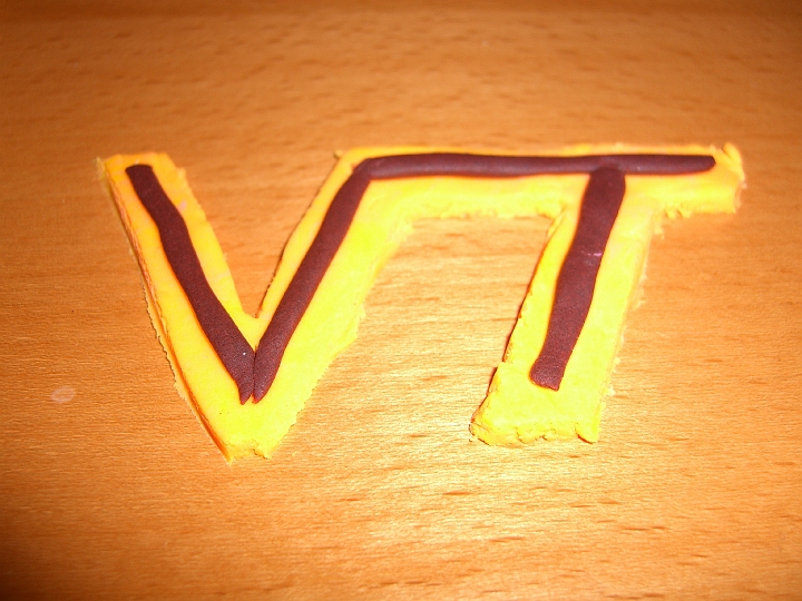 CIMG1582.JPG - I mashed up the remaining pink and yellow to make orange, and the remaining black and red to make maroon, and made a Tech logo.
