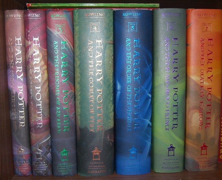 CIMG2088.JPG - I can't decide if it bothers me that my first two don't have the "Year" insignia at the top (because they hadn't started doing that yet). Note the two Hogwarts books (Quidditch Through the Ages and Fantastic Beasts and Where to Find Them) on top of the stack.